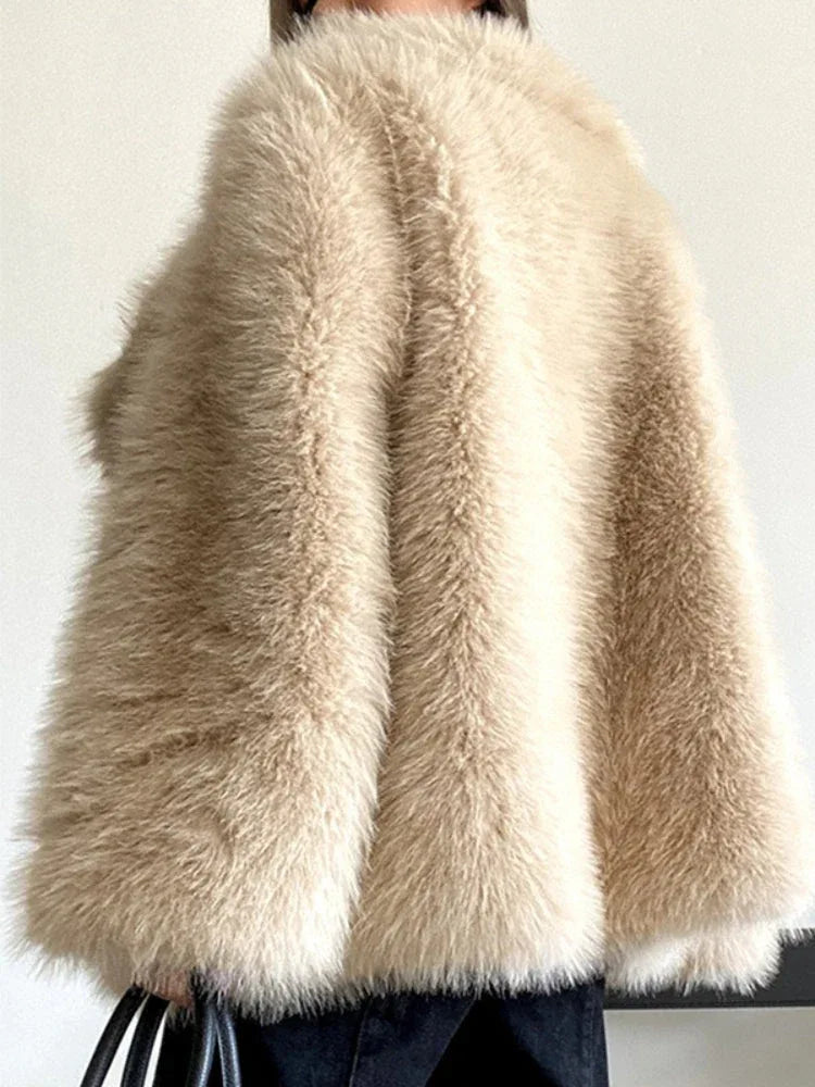 close-up of the texture of a beige faux fur coat