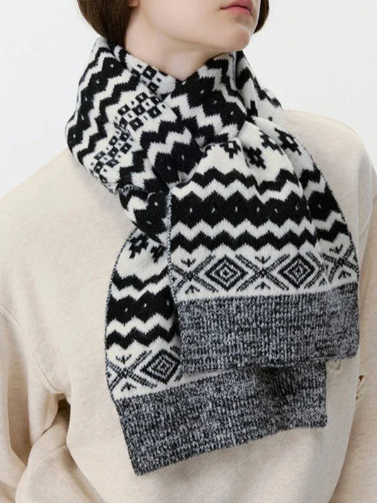 Close-up of a black and white Fair Isle knit scarf with geometric patterns