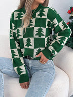 Woman wearing a green and white checkered Christmas tree sweater