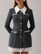 Close-up of the grey tweed mini dress, showing button details and embellishments