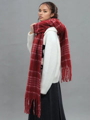 Side profile of a woman showcasing a cozy red plaid scarf draped over her shoulder.