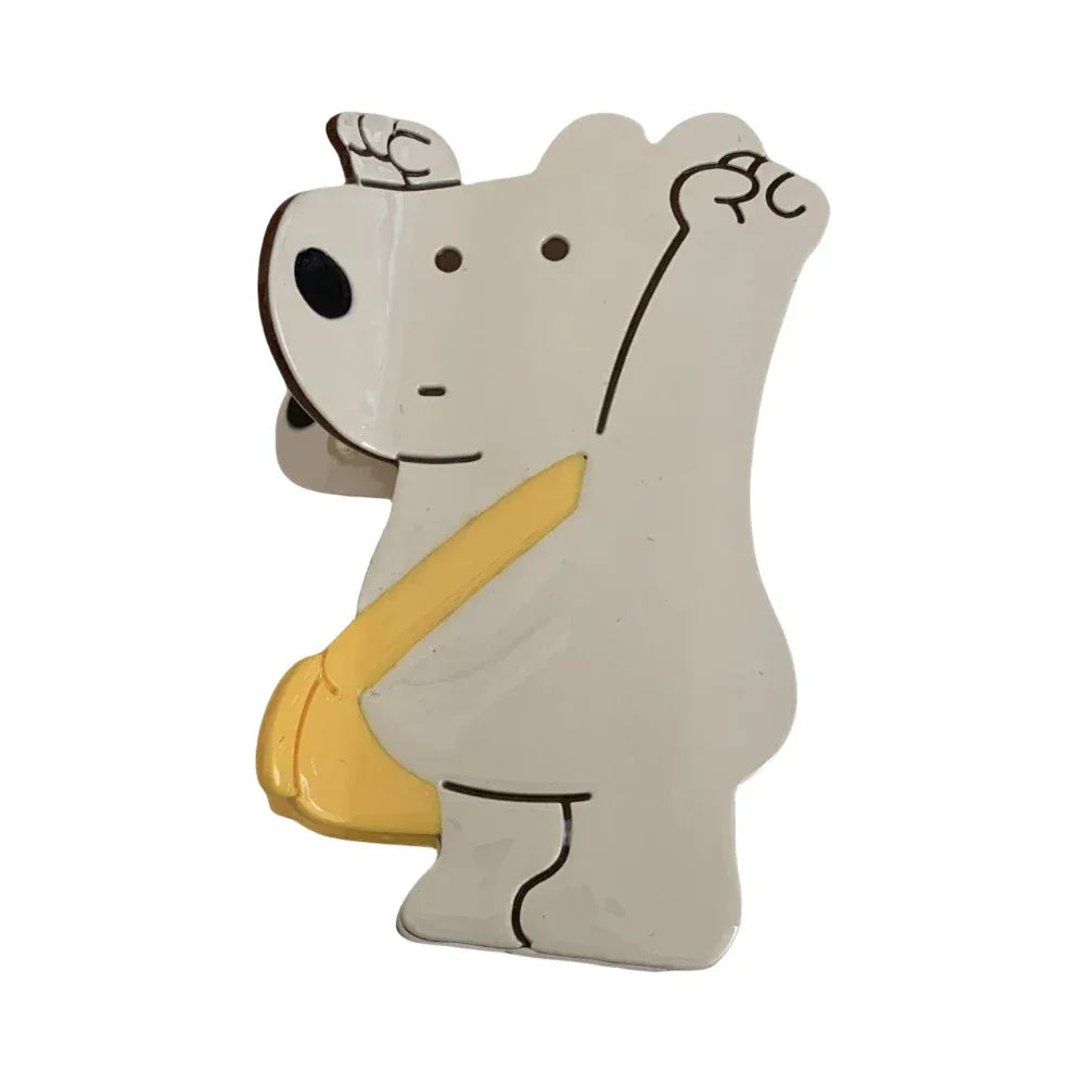 White bear-shaped hair clip with a yellow bag Main image
