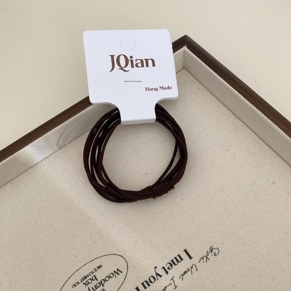 Thin seamless hair elastics in neutral colors - View 8 | TEVQA