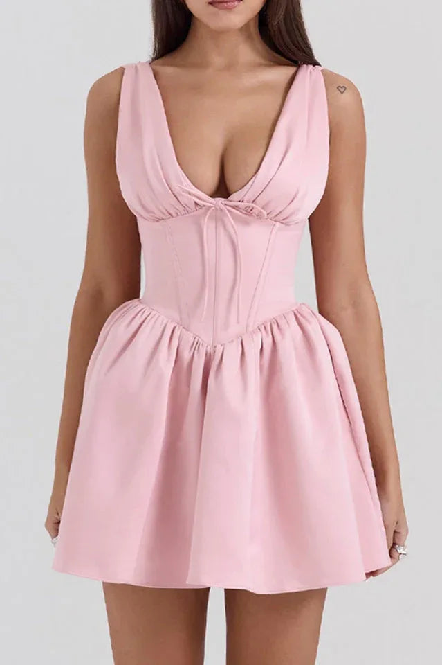 Pink sleeveless V-neck dress with a fitted bodice and flared skirt, front view
