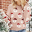 Woman wearing a pink knit sweater with a Santa Claus print