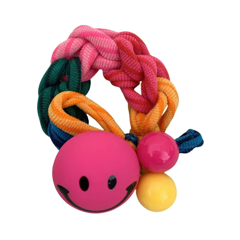 A colorful braided hair tie with a pink smiley face charm and small pink and yellow beads. Main image