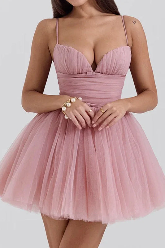 woman in pink mini dress with ruched bodice and tulle skirt