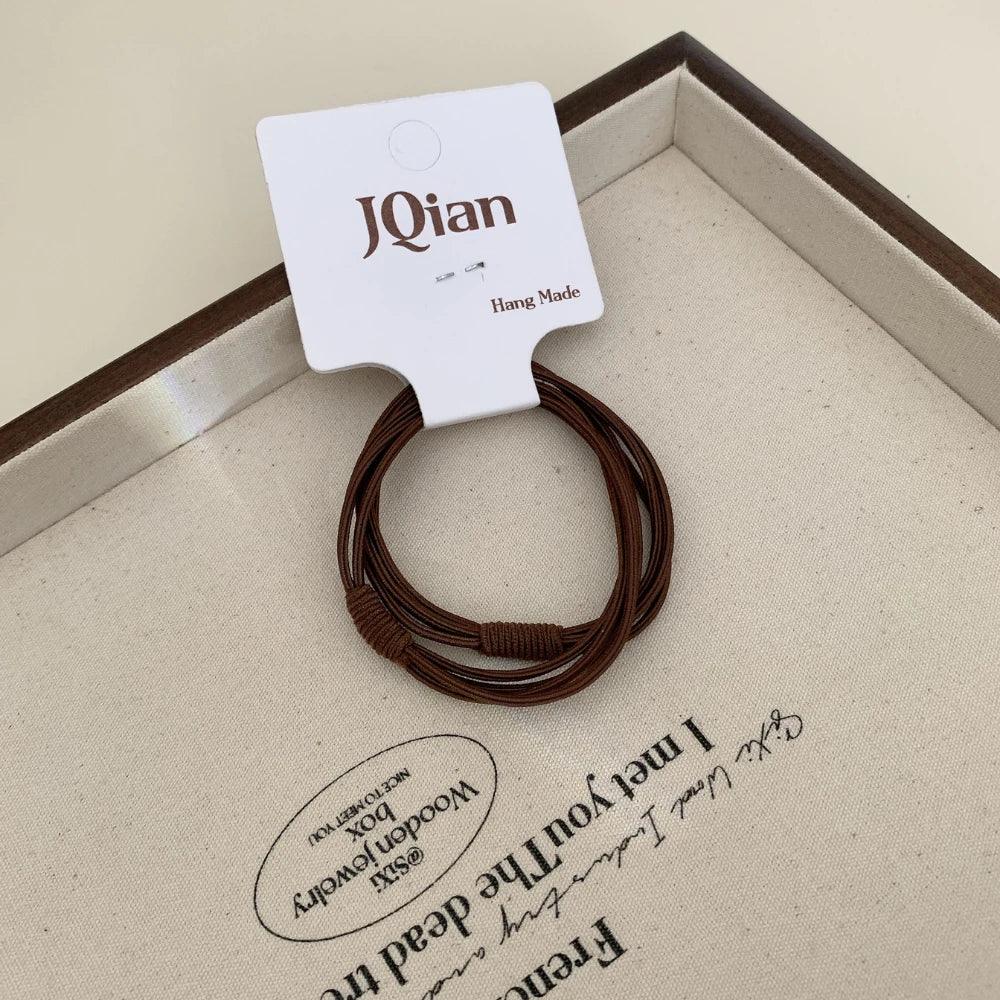Thin seamless hair elastics in neutral colors - View 7 | TEVQA