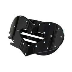 Black heart-shaped hair claw clip with white polka dots and a cut-out heart detail.