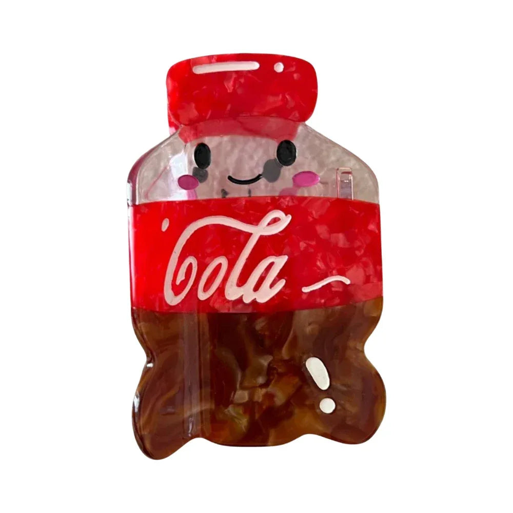 A single cute cola bottle hair clip with a smiling face.