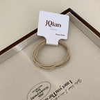 A single pack of JQian beige elastic hair ties, showcasing the product and packaging.