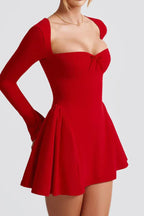 Side view of a red long-sleeved square neck mini dress