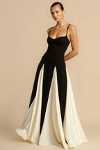Full-length view of a woman in a black and white gown, showcasing the skirt's design.
