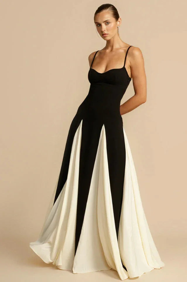 Full-length view of a woman in a black and white gown, showcasing the skirt's design.