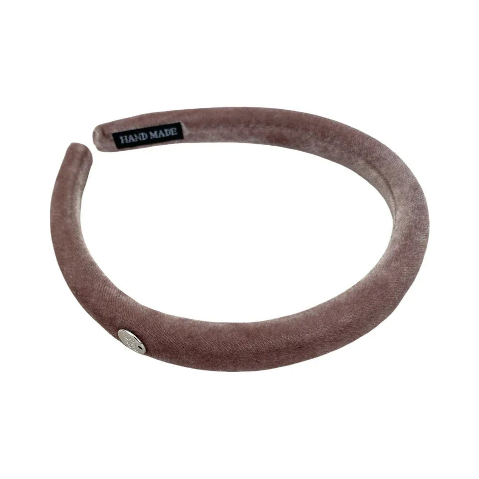 A taupe velvet padded headband with a silver charm and a black "Hand Made" label. Main image