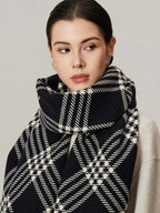 Close-up of a woman wearing a black and white tartan scarf