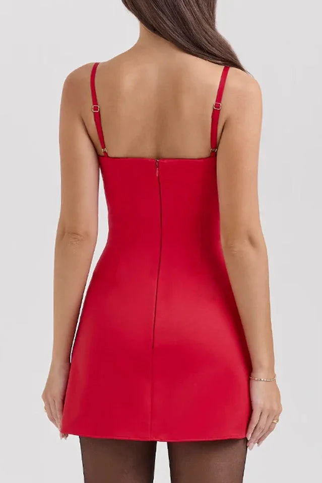 Rear view of a woman wearing a red square neck mini dress