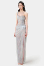 Close-up of the light blue tulle gown, showing lace detailing on the corset and skirt.