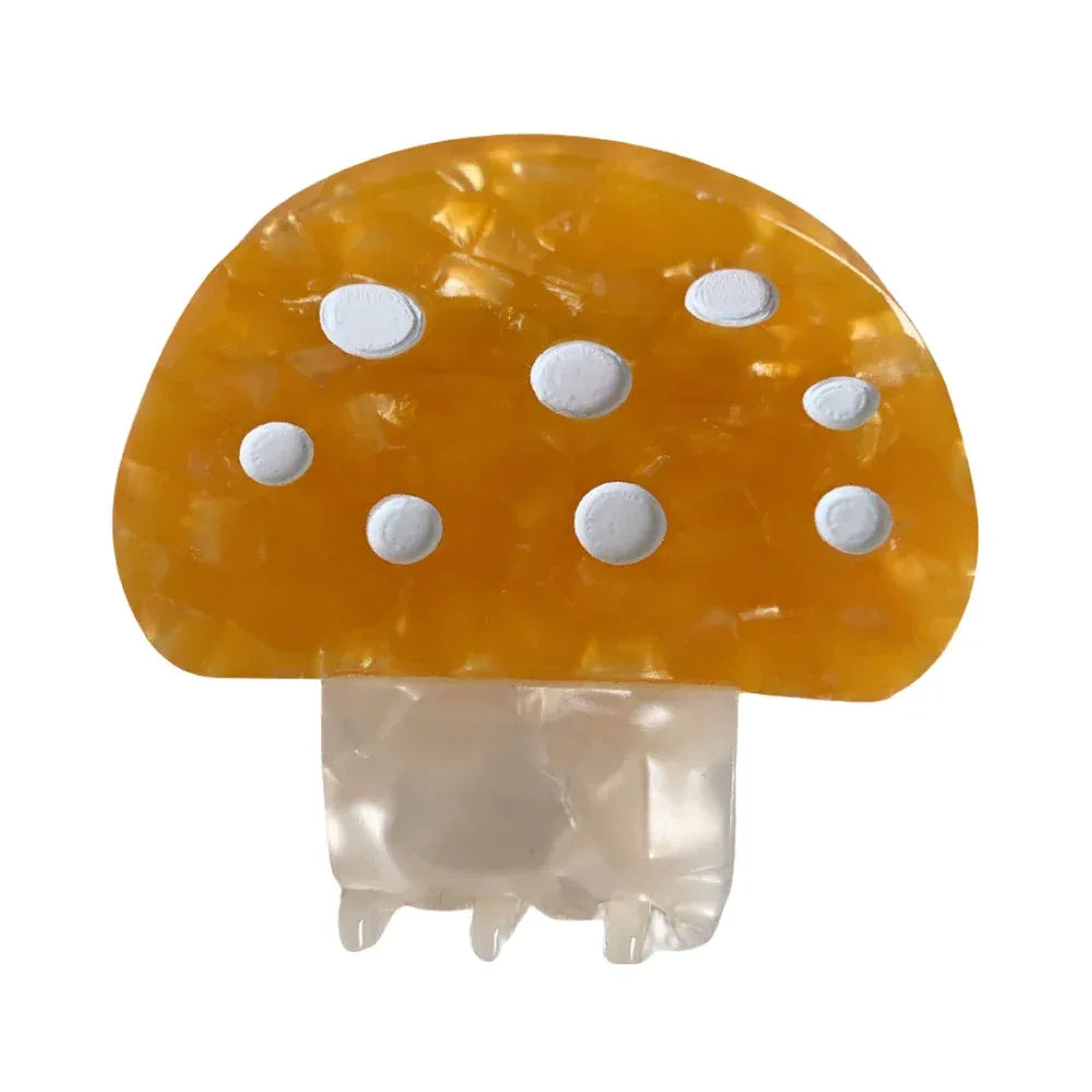 Yellow mushroom hair claw clip with white polka dots