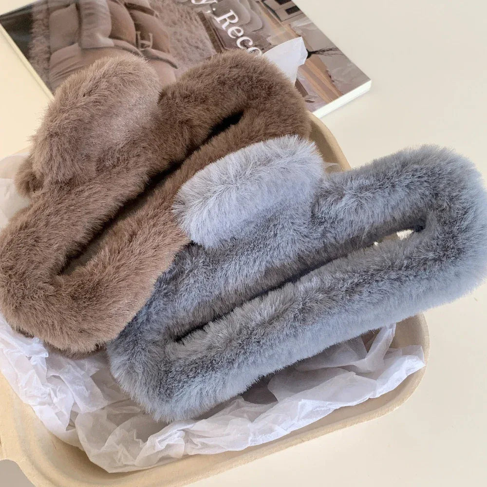 Brown and gray faux fur claw clips in a basket