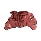 pink acrylic croissant hair clip with bow detail