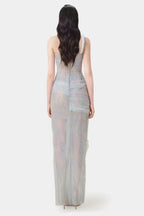 Model wearing a beige sheer tulle gown with a one-shoulder design and corset bodice.