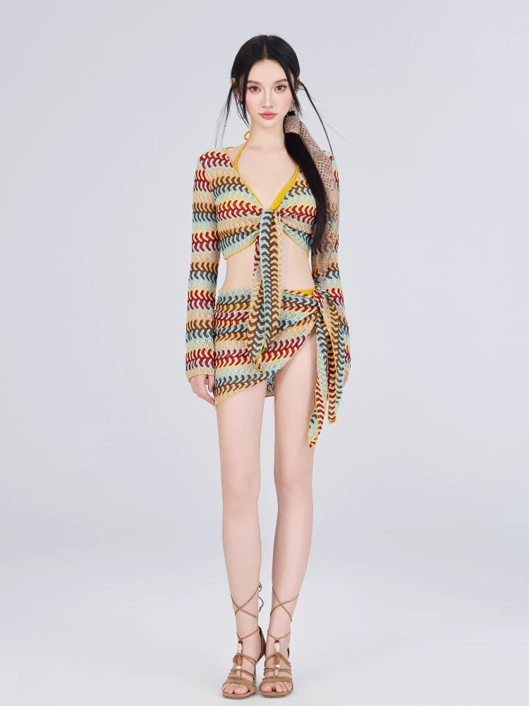 Full-length view of a woman in a crocheted knit outfit with a bikini