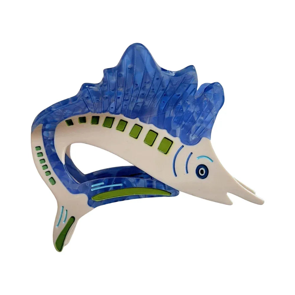 Blue marlin hair clip with white body and green accents Main image
