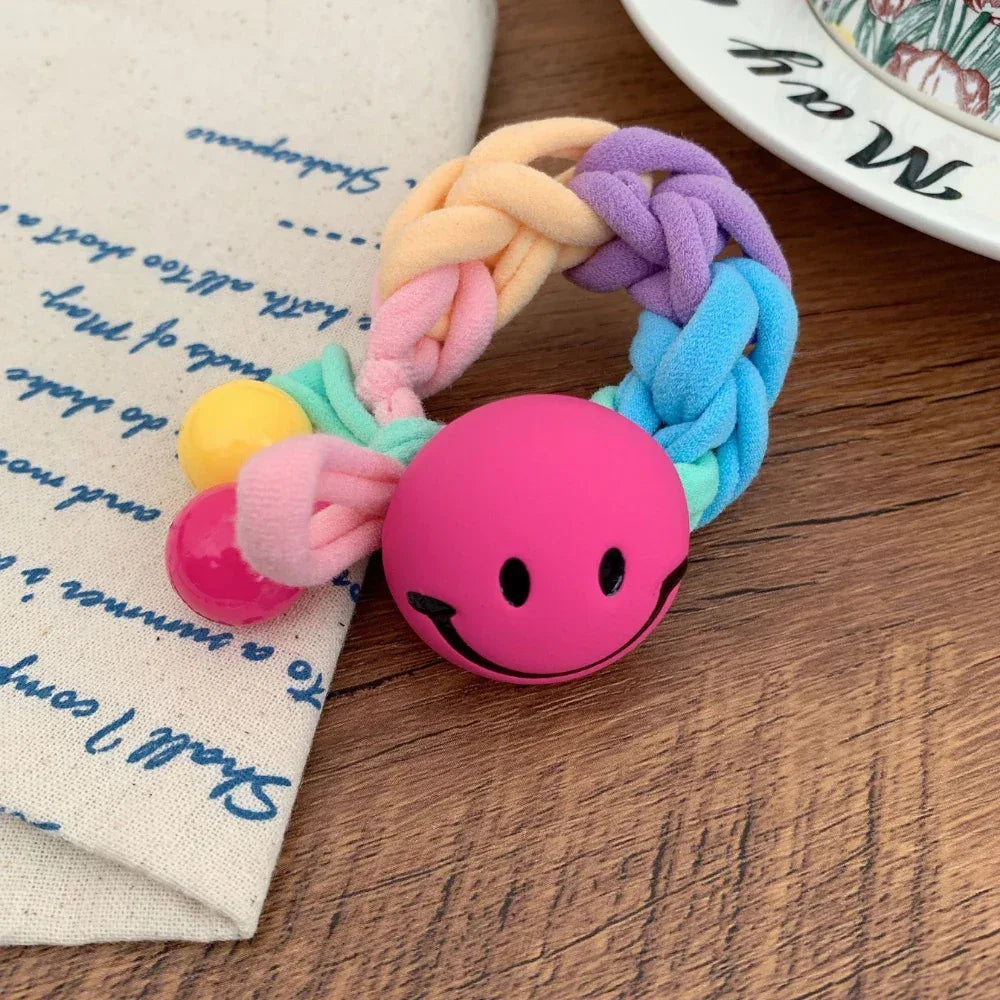 Braided terry cloth hair tie with a yellow smiley face charm - View 9 | TEVQA