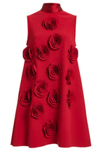 Close-up front view of a red sleeveless A-line mini dress with multiple red appliqué roses.