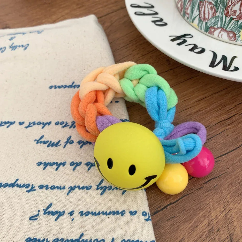 Braided terry cloth hair tie with a yellow smiley face charm - View 6 | TEVQA