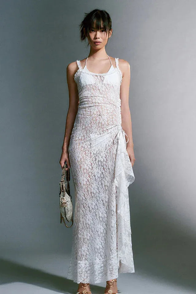 full body shot of a woman in a white sheer lace maxi dress