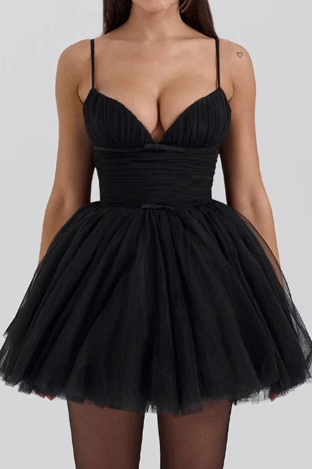 woman in black mini dress with ruched bodice and tulle skirt