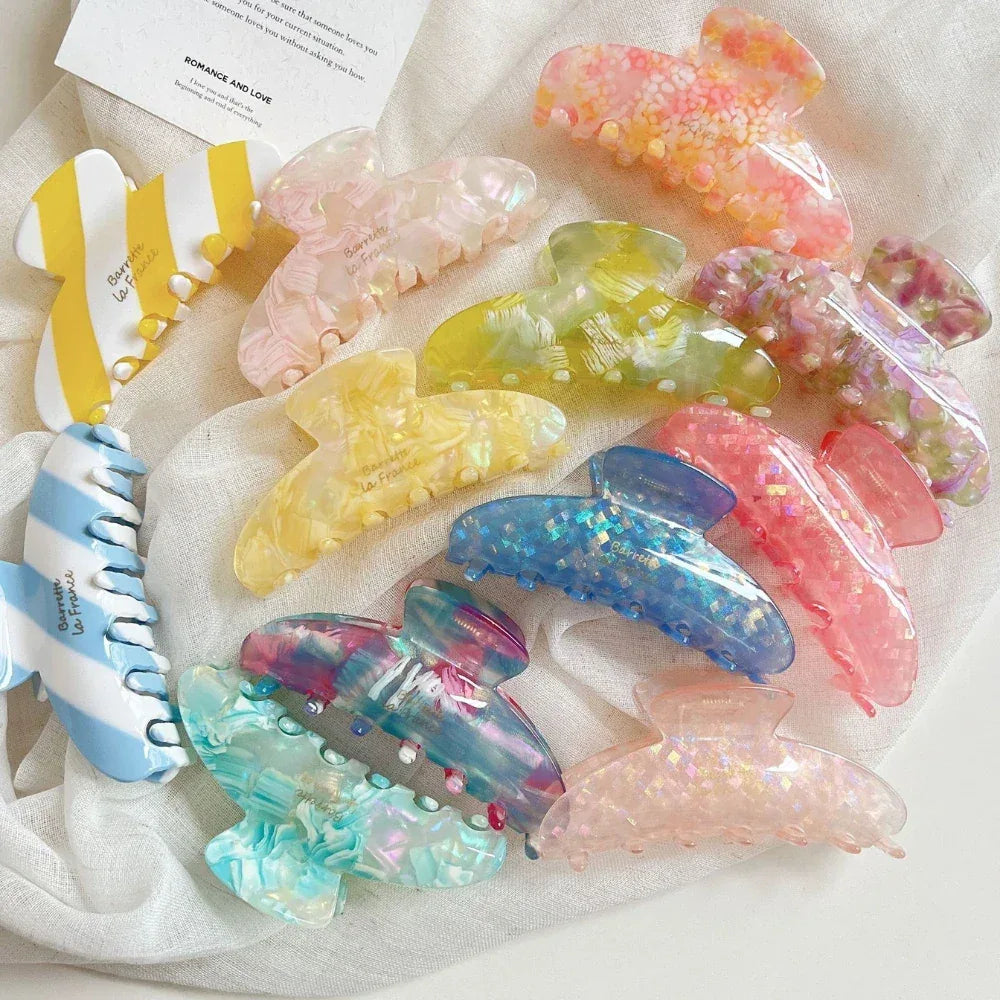 Collection of colorful acetate hair claw clips in various patterns