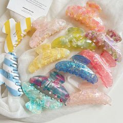 Collection of colorful acetate hair claw clips in various patterns