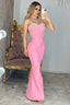 Woman in a pink strapless pearl-embellished mermaid gown posing for a mirror selfie.