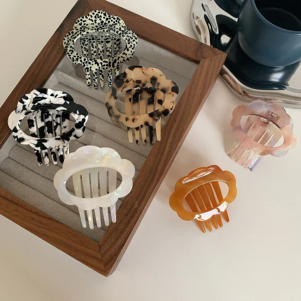 A collection of six cloud-shaped hair clips in various patterns and colors Secondary image