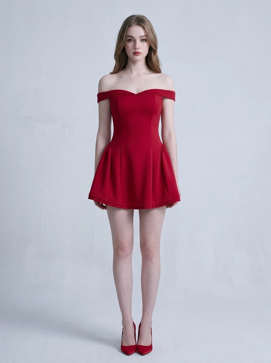 Woman in a red off-the-shoulder mini dress standing against a white background