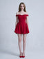 Woman in a red off-the-shoulder mini dress standing against a white background