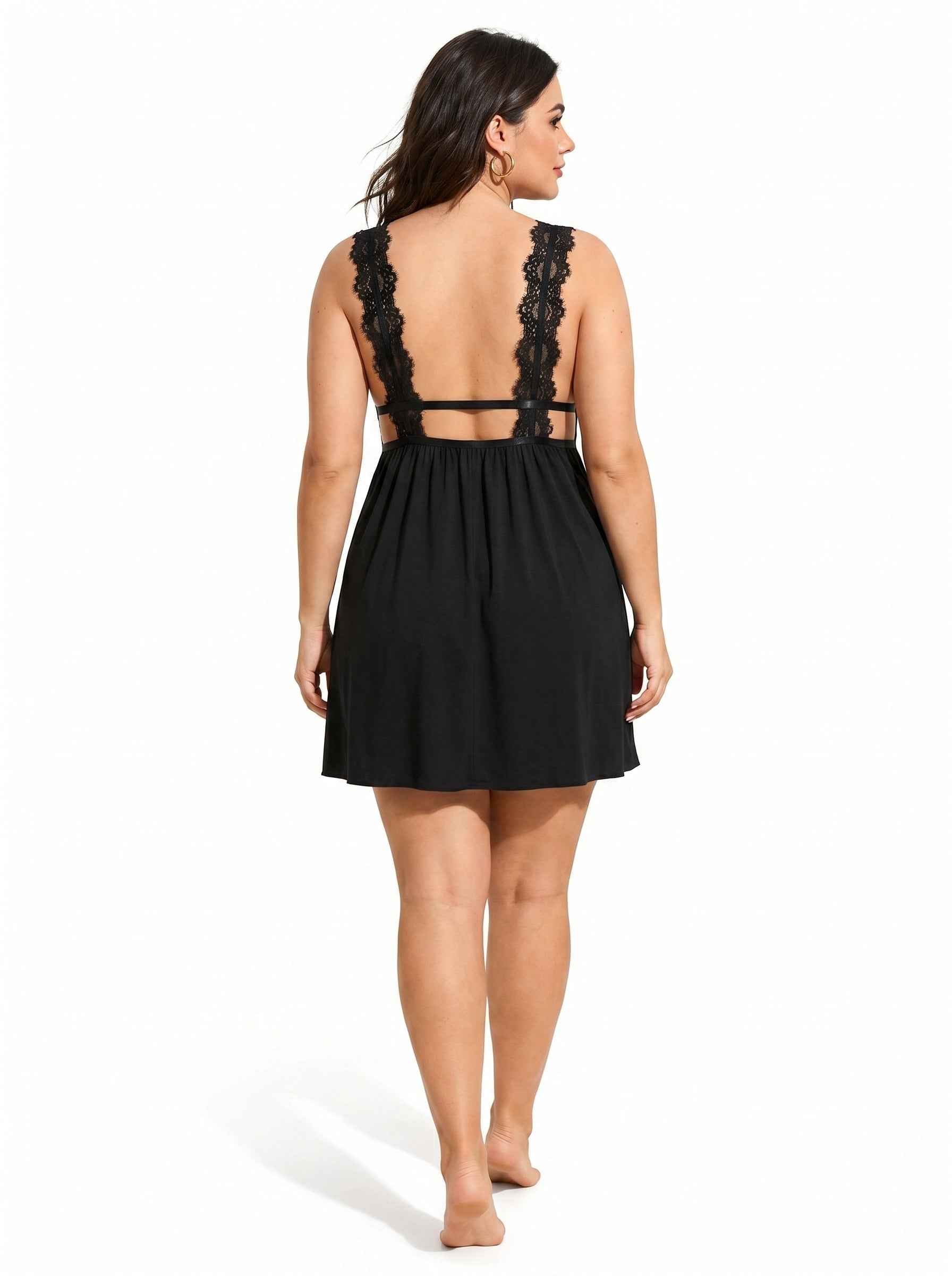 Woman wearing a black lace-trimmed babydoll nightgown from the back