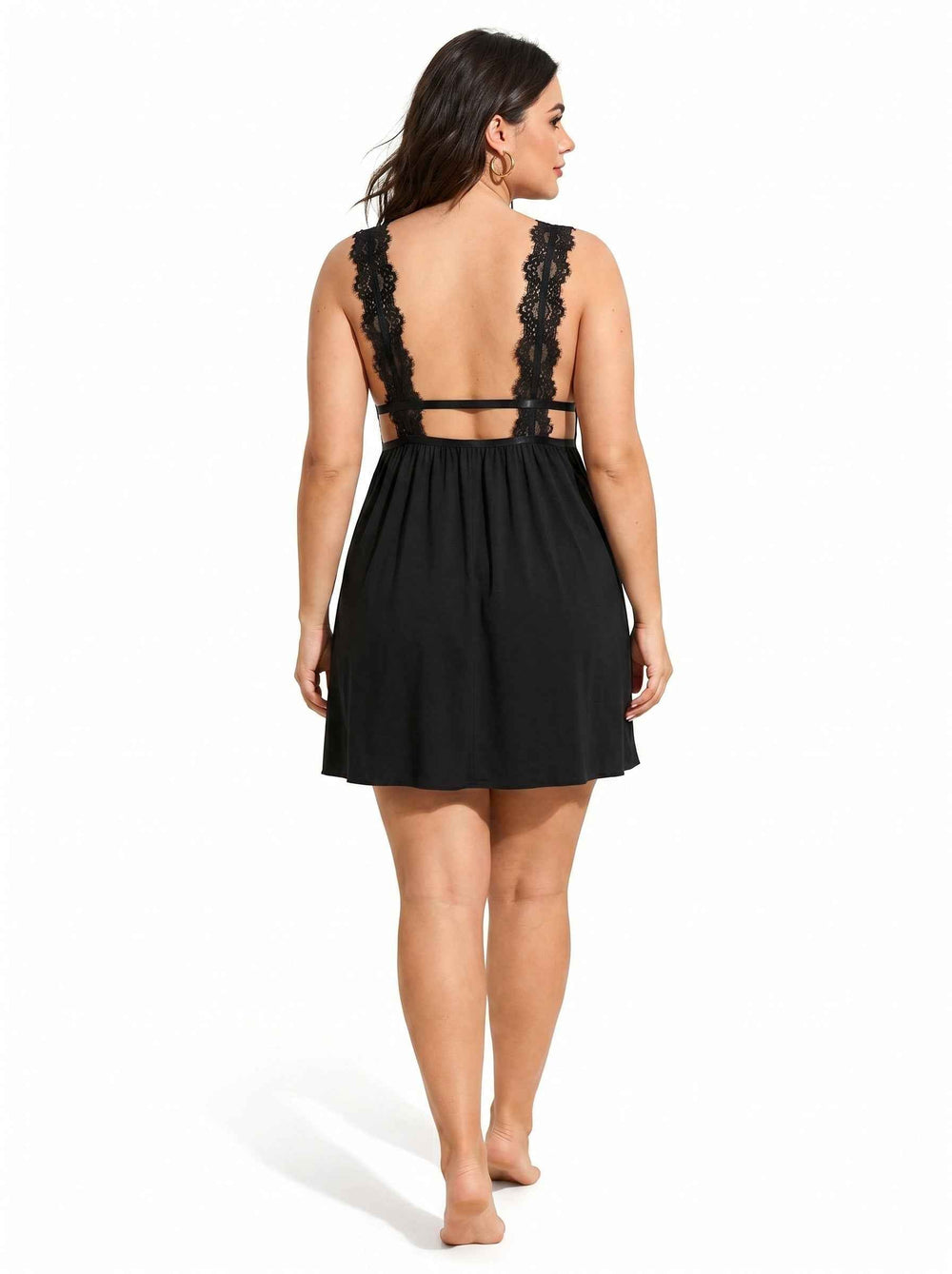 Woman wearing a black lace-trimmed babydoll nightgown from the back