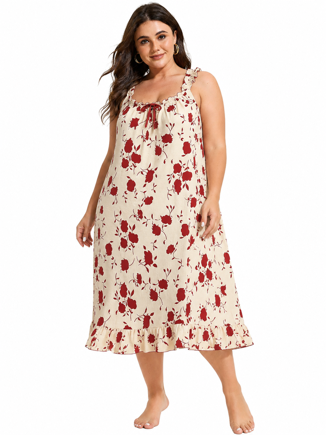 Plus size woman wearing a cream and red floral print nightgown, standing with one leg forward