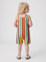 Back view of a child wearing a yellow, red, and blue striped shortall.