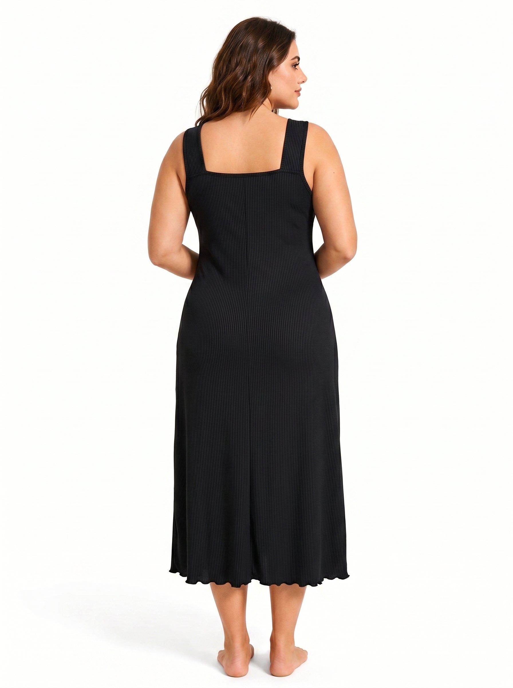 Back view of a woman in a black ribbed knit nightgown