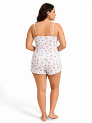 Back view of woman in white floral print pajama set
