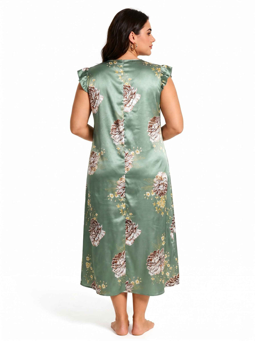 Back view of a woman in a green floral satin nightgown