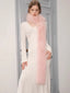 woman wearing a white knit dress and a pink faux fur scarf