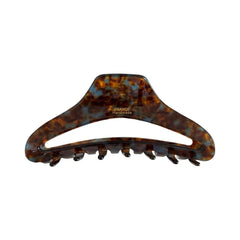 A single tortoiseshell claw hair clip on a white background.
