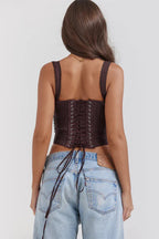 Rear view of a brown satin corset top with lace-up closure