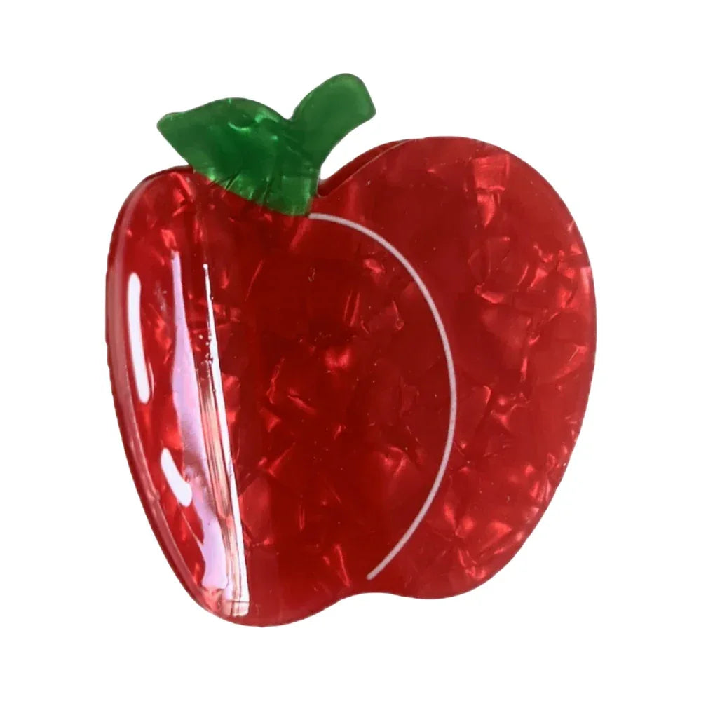 A red apple-shaped hair clip with a green leaf accent. Main image